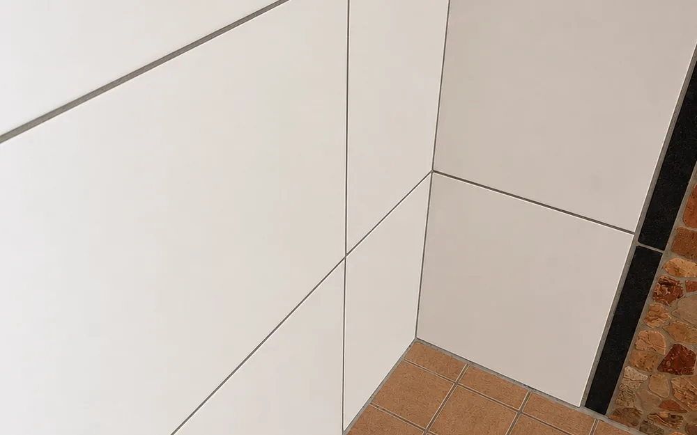 The same bathroom corner after the deep clean — clean surfaces