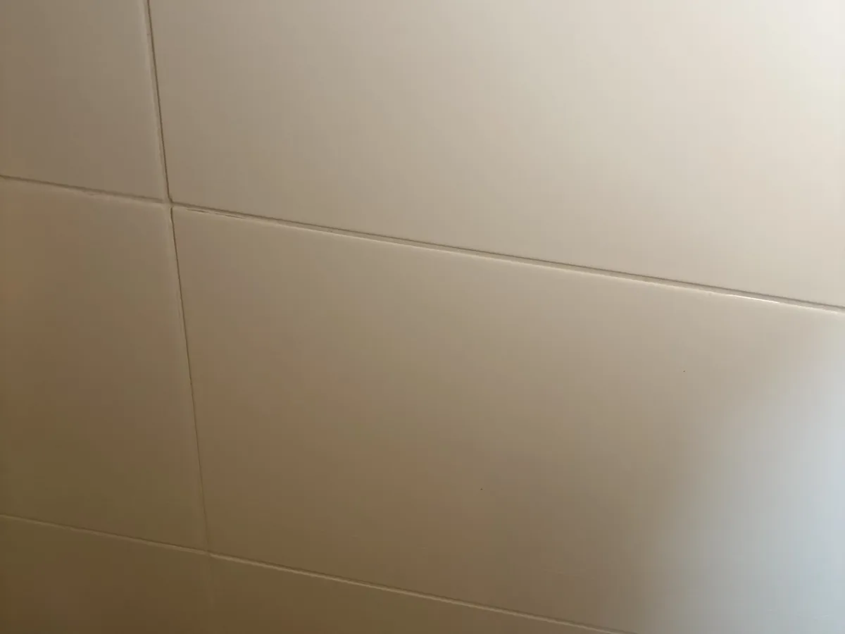 Deep-cleaned bathroom — clean white tiles
